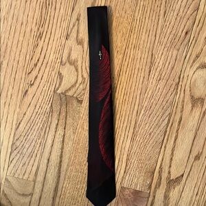 Elegant Black Tie with Red Feather Design
